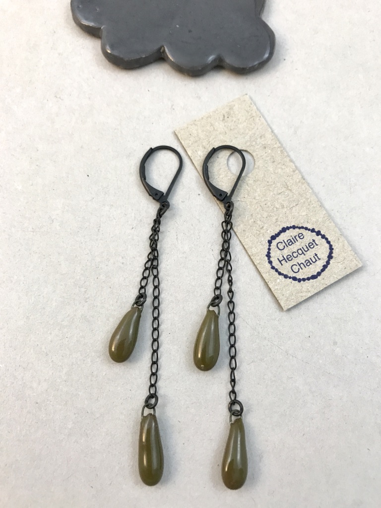 Earrings made of double ceramic drop set at different height.